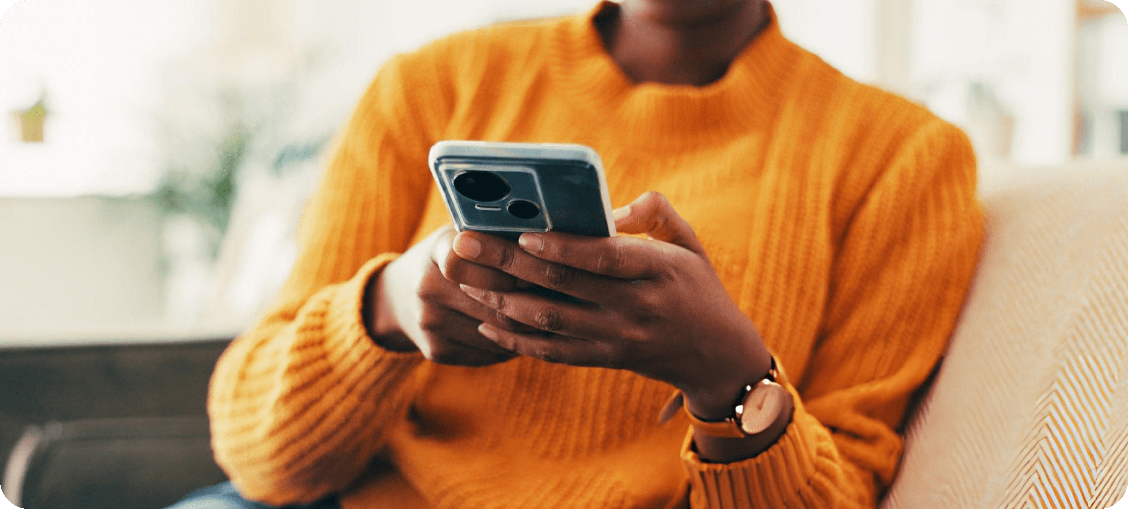 Business owner checking WhatsApp conversations on her phone
